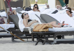 http://img206.imagevenue.com/loc490/th_312314441_Mischa_Barton_Bikini_Candids_on_the_Beach_in_Miami_December_27_2011_168_122_490lo.jpg